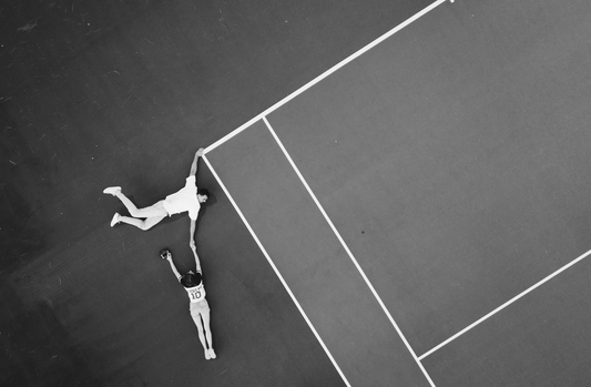 aerial view of couple holding hands on tennis court