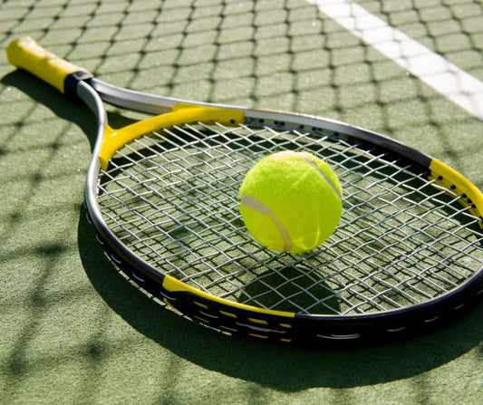 Tennis racquet and ball